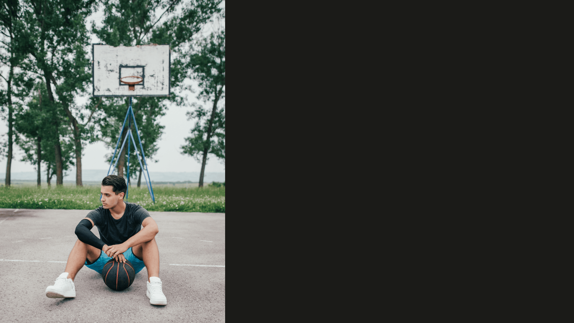 Young athlete sitting on basketball court